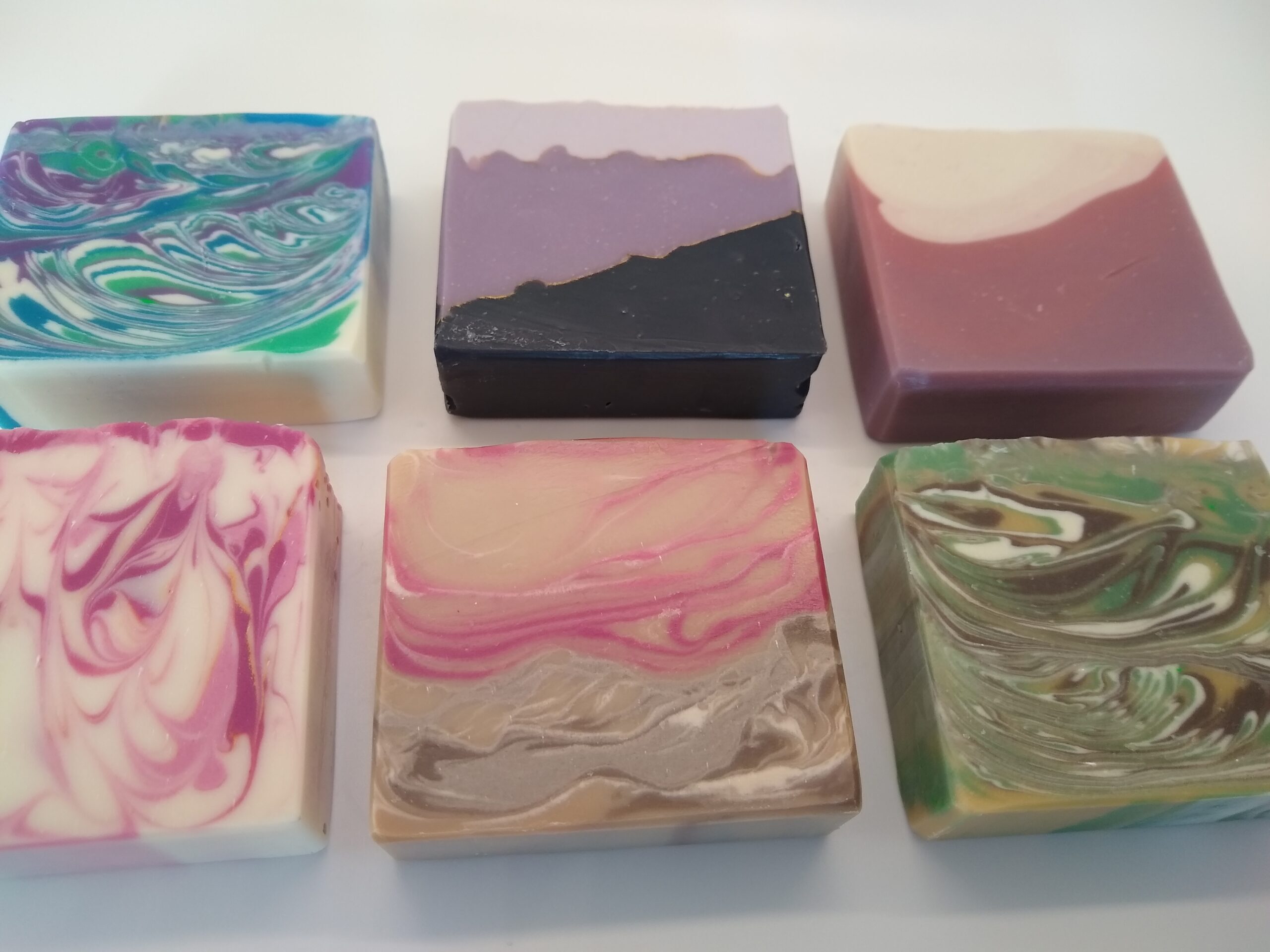 A colorful collection of handcrafted SoapyZen soap bars